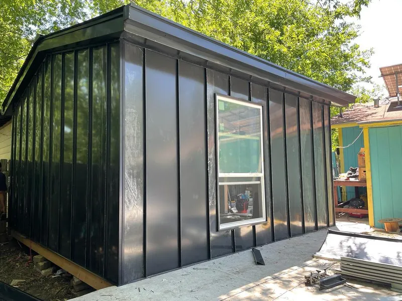 Black standing seam metal wall panels for Roof Inspection in Morgan City