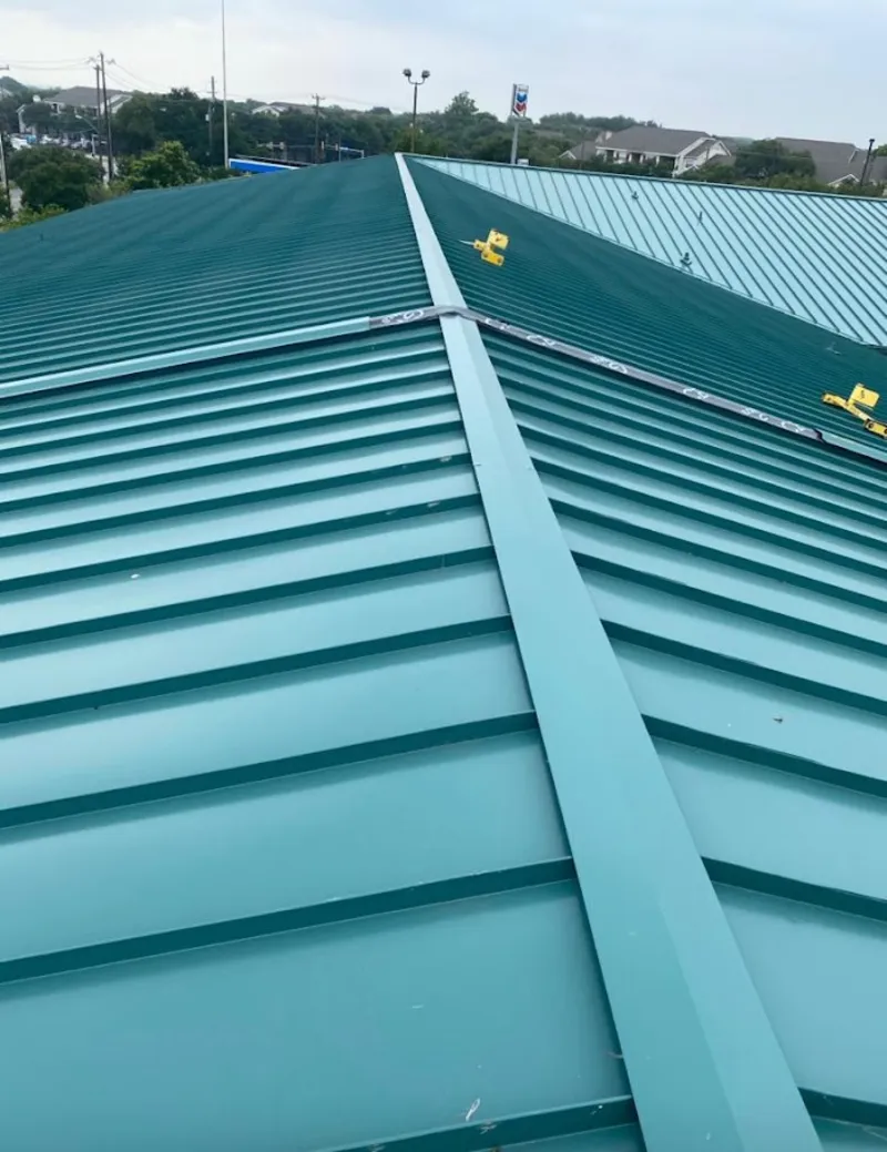 Green commercial metal roof ridge and valley for Metal Roof Repair in Morgan City